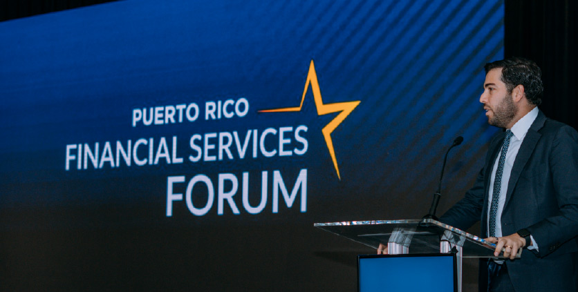 a woman speaking at a L'Oréal Caribe event