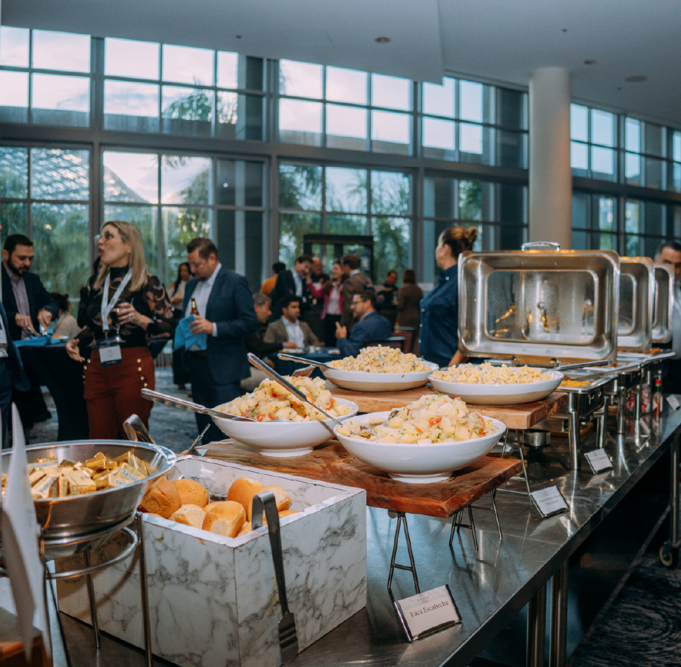 a photo of attendees gathered by the lunch buffet